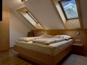 Postelja oz. postelje v sobi nastanitve Haus St. Bernard