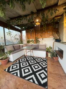 a living room with a couch and a table at Pyramids Top Inn in Cairo