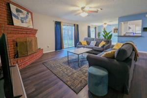 a living room with a couch and a fireplace at Quiet, Spacious, Pet-Friendly in Humble