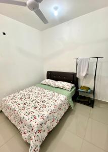 a bed in a white room with a ceiling at Damai Homestay Kuala Krai in Kuala Kerai