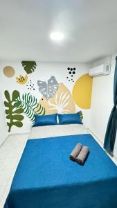 Säng eller sängar i ett rum på Marbar Cartagena Hostel