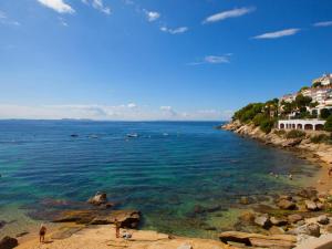 a view of a beach with people in the water at Apartamento Roses, 2 dormitorios, 6 personas - ES-258-76 in Roses