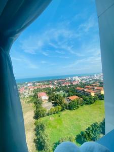 a view of a city from an airplane window at Ghé Home - Homestay Phú Yên in Phu Yen
