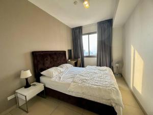 מיטה או מיטות בחדר ב-Unixx South Pattaya High speed Sea View by May’sa