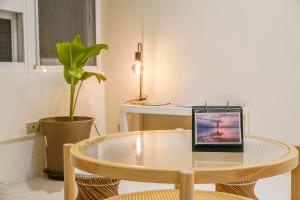 TV in/ali zabaviščno središče v nastanitvi Maybe Homestay
