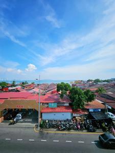 a group of motorcycles parked in a parking lot next to a street at The 60 in George Town +82 photos
