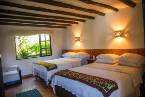 Ένα ή περισσότερα κρεβάτια σε δωμάτιο στο Casa San Nicolas