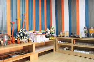 a room with colorful walls and tables with food at Mai Phuong Resort Phu Quoc in Phú Quốc