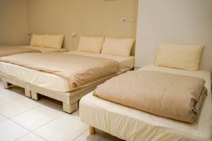 Postelja oz. postelje v sobi nastanitve Maybe Homestay