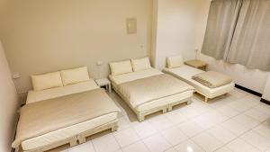 Postelja oz. postelje v sobi nastanitve Maybe Homestay