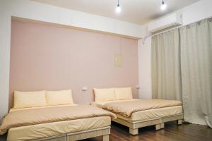 Postelja oz. postelje v sobi nastanitve Maybe Homestay