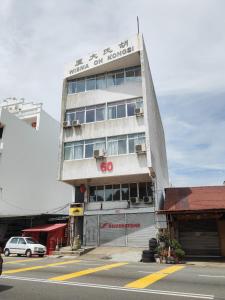a building with a sign on the side of it at The 60 in George Town