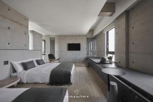 Postel nebo postele na pokoji v ubytování Penghu Somewhere Guesthouse 澎湖嶼光角落民宿 + 37 fotografií