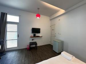 TV a/nebo společenská místnost v ubytování Snore Inn