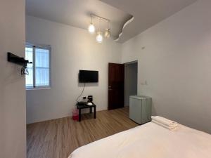 TV a/nebo společenská místnost v ubytování Snore Inn