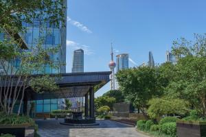 a view of the sydney city skyline from a park at Regent Shanghai Pudong - Complimentary first round minibar per stay - including a bottle of wine in Shanghai