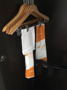 a rack with two towels hanging from it at Suburban Studios by Choice Hotels- All American Staff - Ultra Sparkling - In-Room Kitchens - Sparkling Rooms - I-95 - Exit 36 - Special Rates - Smoking and Non Smoking Rooms - Stay & Save Today in Brunswick