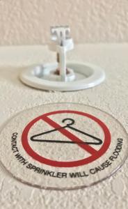 a bathroom sink with a no swimming sign on it at Suburban Studios by Choice Hotels- All American Staff - Ultra Sparkling - In-Room Kitchens - Sparkling Rooms - I-95 - Exit 36 - Special Rates - Smoking and Non Smoking Rooms - Stay & Save Today in Brunswick