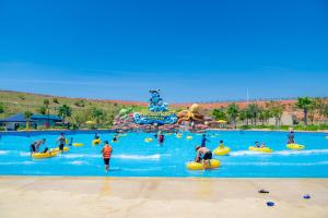 a group of people in a water park at Wonderland Resort Phan Thiet in Phan Thiet