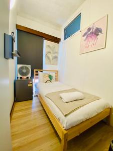 Voodi või voodid majutusasutuse Private Room in Sans Souci Guesthouse - Sharehouse toas