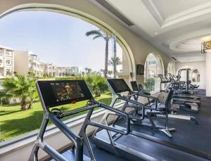 a row of exercise bikes in a gym at Hawaii hotels & blend club resort&sea jul& in Hurghada