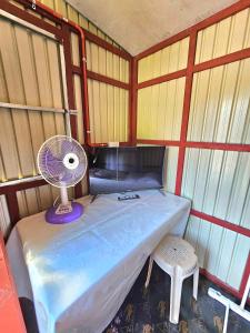 Giường trong phòng chung tại Nangalisan Liliz Lee Private Resort and Accomodation