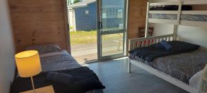 Postel nebo postele na pokoji v ubytování Tongariro Estate