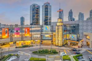 a city with tall buildings in the background at Free Breakfast 3BR Oasis Minutes From Downtown Metrotown in Burnaby