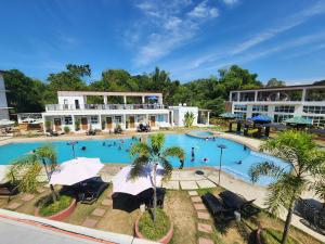 an overhead view of a large swimming pool at a hotel at JADE RESORT - Bauang, La Union in Bauang