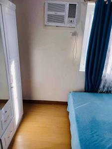 Ένα ή περισσότερα κρεβάτια σε δωμάτιο στο JD’s 1 Bed Room Staycation