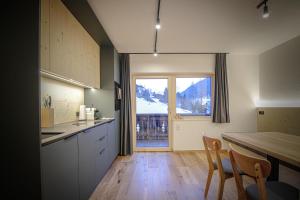 Kuchyň nebo kuchyňský kout v ubytování WOLF Apartments Padaun