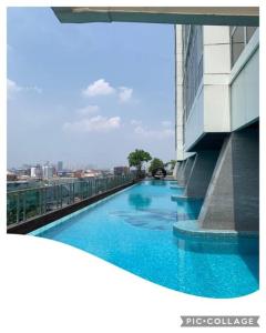 a swimming pool on the side of a building at Menteng Park - Tower Diamond, 2 Bed Rooms, Private Lift in Jakarta