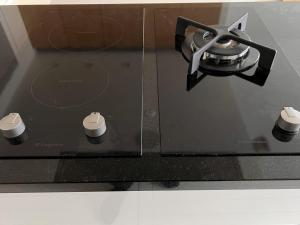 a close up of a stove top with a burner at Central Helsinki Punavuori 40m2 entire flat in Helsinki