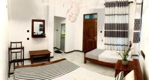 Letto o letti in una camera di Dimuthu Green Villa