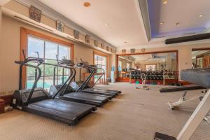 a gym with several treadmills in a room at The Subic Bay Yacht Club, Inc. in Olongapo