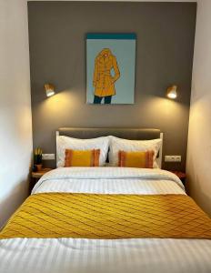 a bedroom with a large bed with a yellow blanket at Capital Towers RZESZOW, free parking, terrace in Rzeszów