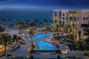 an aerial view of the resort at night at Capital Stay - 2 Bed Apartment- The Address Fujairah in Fujairah