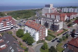 an aerial view of a city with buildings and the ocean at Haus Pavillon, App 20 in Döse