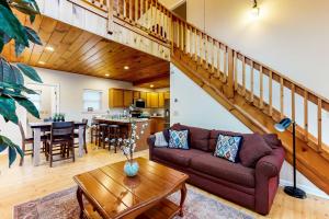 a living room with a couch and a table at Up on Tanner Trail in Waynesville