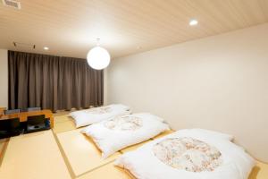 Postel nebo postele na pokoji v ubytování Fuji Shoei Hall - Vacation STAY 09374v