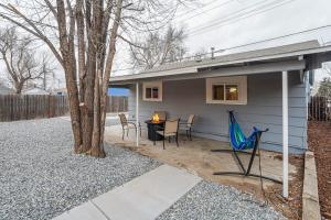 a patio with a table and chairs next to a house at Bonny Creation - Chic Downtown Convenience Hot Tub in Colorado Springs