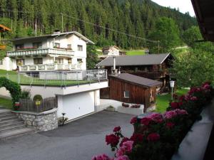 a view of a house with a balcony and flowers at Binder's Saghaus in Ried im Zillertal