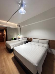 Krevet ili kreveti u jedinici u okviru objekta Travelbee Seaside Inn