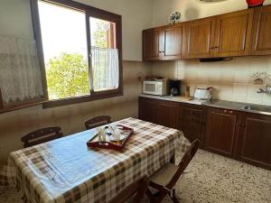 a kitchen with a table with a tray of food on it at Maison authentique avec grande terrasse in Kritinía