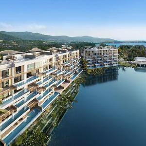 an aerial view of a large building in the water at Angsana Oceanview Residences by Laguna Phuket in Bang Tao Beach