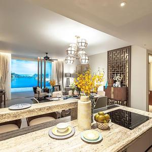 a living room with a kitchen and a dining room at Angsana Oceanview Residences by Laguna Phuket in Bang Tao Beach