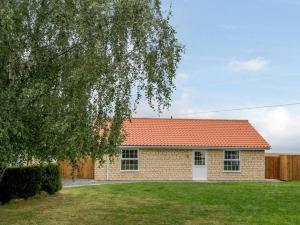 a small brick house with an orange roof at 2 Bed in Lincoln 85194 in Potter Hanworth