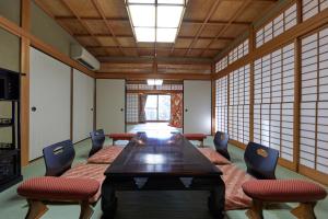 a conference room with a table and chairs at Kyo-machiya Stay WAKA Fushimiinari in Kyoto