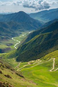 a view of a valley with a river and mountains at Ulush Yurts in Song-Kul +12 photos