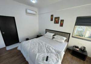 Ένα ή περισσότερα κρεβάτια σε δωμάτιο στο Sunny Executive